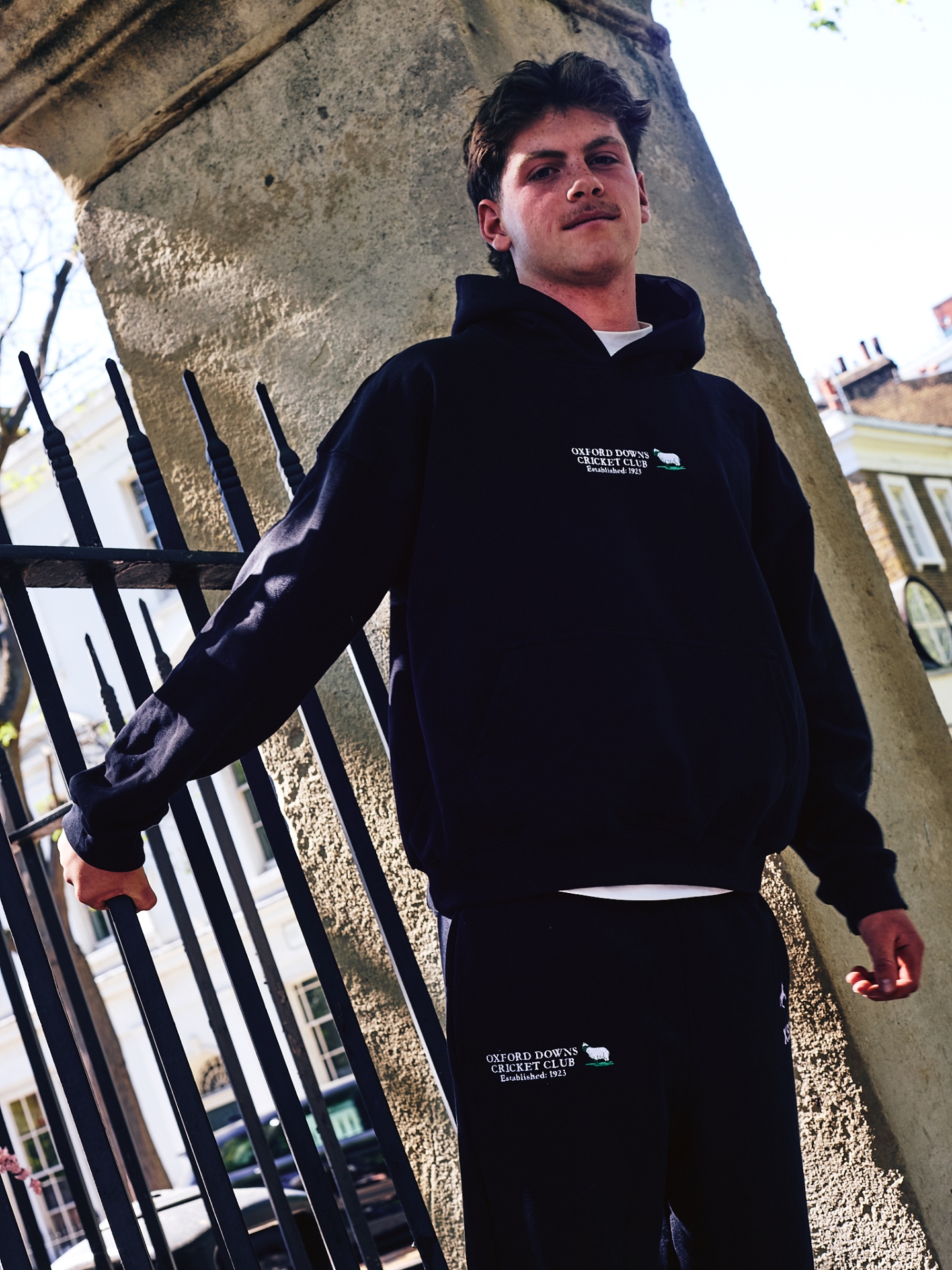 black hoodie in action